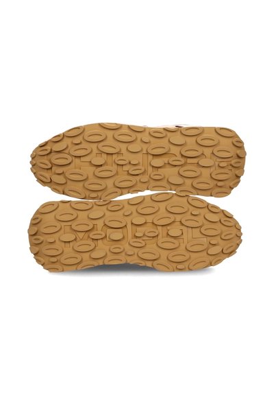 Suola in gomma con una superficie testurizzata e decorata con forme ovali, di colore beige. Il design della suola è robusto e offre aderenza.