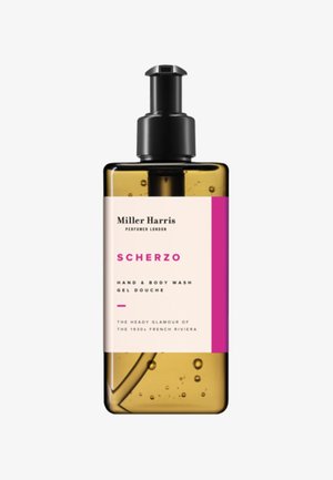 Braune Bernstein-Kunststoffpumpe mit schwarzem Pumpkopf. Das Etikett zeigt pinke und weiße Bereiche; der Text enthält "Scherzo" und Produktinformationen.