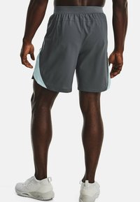 Gray athletic shorts with light blue side accents, elastic waistband, and a smooth texture, designed for comfort and mobility.