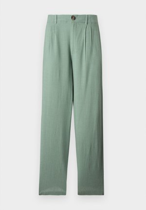 Παντελόνι από λινό φασκόμηλο με ψηλή μέση, πιέτες, θηλιές για ζώνη και ένα καφέ κουμπί για κλείσιμο.