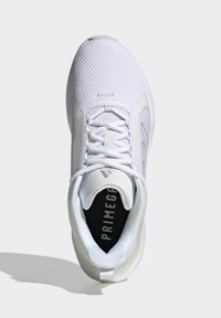 White athletic shoe featuring a mesh upper, lace closure, cushioned sole, and a black insole with 'PRIMEGREEN' printed in white.