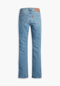Light blue denim jeans with a straight-leg cut, two back pockets, and a brown leather patch on the waistband. Classic stitched detailing.