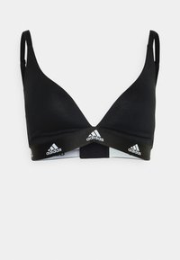 Black sports bra with adjustable straps, seamless cups, and a wide elastic band featuring white adidas branding. Smooth, stretchy fabric.