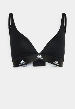 Crni sportski grudnjak s podesivim trakama, bezšavnim čašama i širokim elastičnim pojasom na kojem je bijeli adidas logo. Glatka, rastezljiva tkanina.