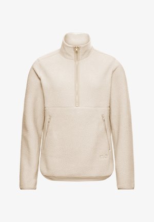 Lichtbeige fleece trui met hoge kraag, halve ritssluiting aan de voorkant, twee zijzakken, textuur aan de buitenkant, en subtiele branding aan de onderkant vooraan.