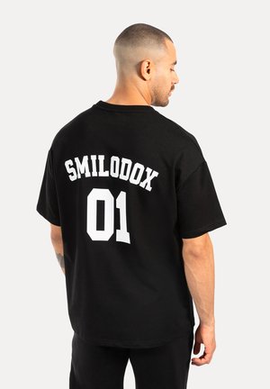 Camiseta estampada - schwarz