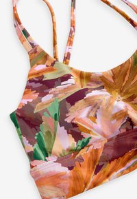 Blomsterprint bralette med multikolor mønstre i nuancer af grøn, orange, pink og brun. Fremstillet af let, strækbart stof.