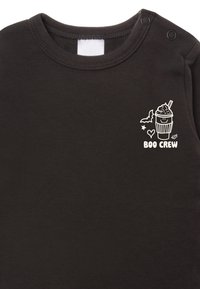 Black cotton onesie featuring a white graphic of a drink with a swirl topping, bat, stars, and the text "BOO CREW" on the chest.