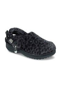 Fuzzy black slipper with leopard print, open back, and side accents including a silver flower charm and yin-yang detail. Rubber sole.