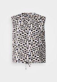 Blouse sans manches avec motif géométrique noir, blanc et beige, encolure froncée et lien à nouer à l’ourlet.