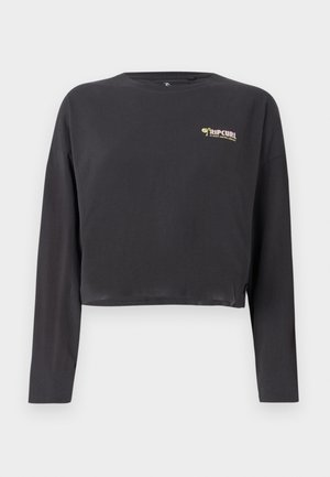 Cropped long-sleeve t-shirt in dark gray cotton, features a small, multicolored Rip Curl logo on the chest and a relaxed fit.
