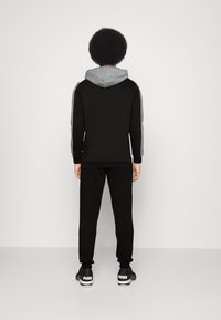 Puma HOODED COLORBLOCK SUIT SET - Chándal - black