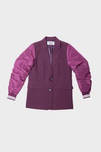 Maroon blazer with glossy, puffy sleeves in a lighter shade; features two buttons, side pockets, and striped accents on sleeve cuffs.