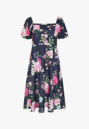 Robe midi bleu marine avec manches ballon, encolure carrée, et imprimé floral vibrant en rose, blanc et violet sur toute la surface.