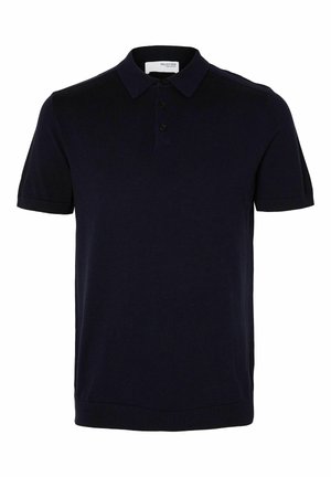 Polo bleu marine en tissu doux, avec un col classique, patte à trois boutons, manches courtes et ourlet côtelé.