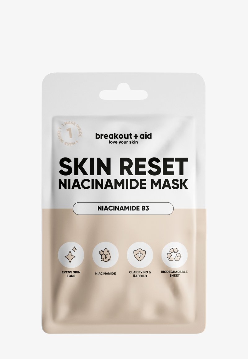 Maschera in tessuto con niacinamide in un sacchetto bianco e beige. Presenta icone per i benefici: tono della pelle uniforme, niacinamide, chiarificante, biodegradabile.