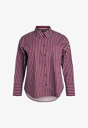 Kohvioh shirt, millel on vertikaalsed valged triibud, krae, pikad varrukad, rinnatasku ja horisontaalsed triibud varrukate otstes.