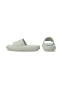 Light green slip-on sandals featuring a ridged texture, wide strap, and a contoured footbed; rear view shows an open heel design.