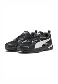 Black athletic shoes with mesh and synthetic material, featuring a white logo and accents, sculpted sole, and textured surfaces.