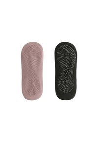 Two textured yoga socks: one in soft pink with a dotted grip pattern, the other in black with a ribbed design and similar grip.