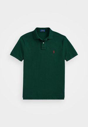 Dark green polo shirt made of cotton, featuring a classic collar, two buttons, and a small red logo on the left chest.