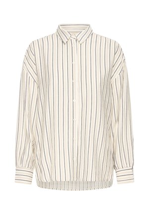 Pika varrukaga nööpidega särk, millel on vertikaalsed triibud beežis, valges ja mustas, terava krae ja mansettidega.