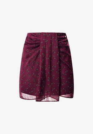 Burgunderfarvet nederdel lavet af let stof, med små bladmønstre i grøn og gul, med draperinger ved taljen.