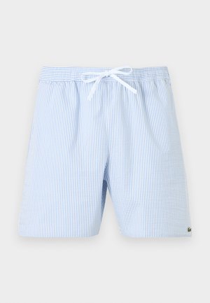 Ανοιχτό μπλε και λευκό ριγέ σορτς με κορδόνι, ελαστική μέση και μικρό πράσινο λογότυπο στο κάτω δεξί πόδι.