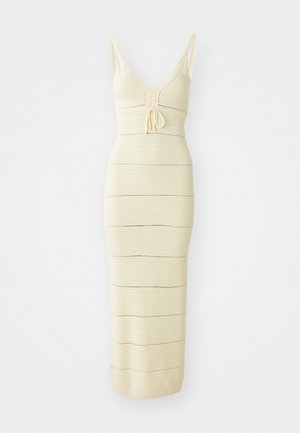 Knit midi dress in light cream with a fitted design, V-neckline, adjustable tie at the waist, and horizontal stripe details.