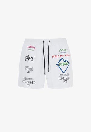 Costumi da bagno bianchi realizzati in tessuto leggero, decorati con vari loghi e testi stampati in rosso, verde e blu. Comprendono una vita con cordino.