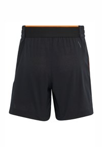 Black athletic shorts with a textured surface, elastic waistband, and contrasting orange accent at the waist. Lightweight polyester material.