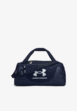 Navy blue duffel bag made of durable fabric, featuring a large white logo, two handles, and an adjustable shoulder strap.