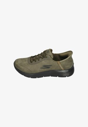 Olive green suede walking shoe with a rounded toe, lace-up front, black rubber sole, and textured accents. Features brand logo on side.