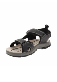 Sandalia negra con correas de velcro ajustables, plantilla acolchada y suela de goma texturizada. Cuenta con un bucle para facilitar su uso.