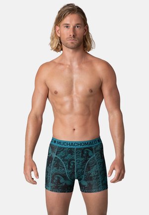 Men's boxers made of stretch fabric featuring a black and teal graphic design, with a thick blue waistband labeled "MUCHACHOMALO."