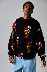 Suéter negro de punto con un patrón gráfico colorido de manos con guantes de diferentes colores. Corte holgado con un cuello y puños acanalados.