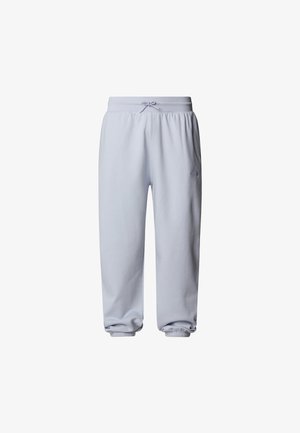 Pantaloni della tuta azzurri chiari realizzati in morbido cotone, con elastico in vita e polsini elasticizzati, e un piccolo logo sulla gamba sinistra.