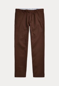 Bruna bomullsbyxor med rak front, bälteshällor, sidofickor och en mjuk yta. Bensluten är något avsmalnande.