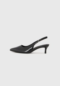 Black patent leather slingback heels with a pointed toe and a low kitten heel, featuring an adjustable strap and a smooth glossy finish.