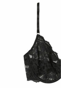 Svart spetsbralette med blommönster, justerbar satinrem och vågigt kantband längs kanterna. Mjukt, genomskinligt material.