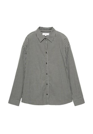 Camicia a quadri bianca e nera, con bottoni sul davanti, colletto a punta e maniche lunghe dal taglio rilassato. Tessuto in cotone.