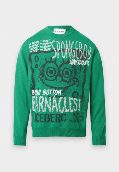 Zeleno pleteno pulover z velikim grafičnim motivom SpongeBob SquarePants, poudarjenim besedilom in rebrastimi manšetami. Besedilo vključuje "Pripravljen sem!" in "Klop!"