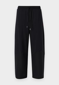 Zwarte sportbroek met een elastische tailleband en verstelbaar trekkoord. Voorzien van paneeldetails en een losse, cropped pasvorm. Gladde textuur.