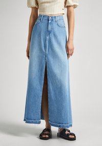 Light blue denim maxi skirt with a front slit, frayed hem, and a high waist. Finished with a button closure and belt loops.