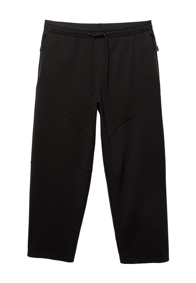 Schwarze Sporthose aus weichem Material mit elastischem Bund und verstellbarem Kordelzug. Verfügt über schräg verlaufende Nahtdetails und Seitentaschen.
