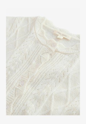 Cardigan en tricot ivoire avec des motifs de câbles complexes, doté d'un col rond, de fermetures à boutons et d'une texture douce. Marque : Laura Ashley.