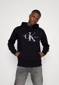 Calvin Klein Jeans SEASONAL MONOLOGO REGULAR HOODIE - Camisola - black