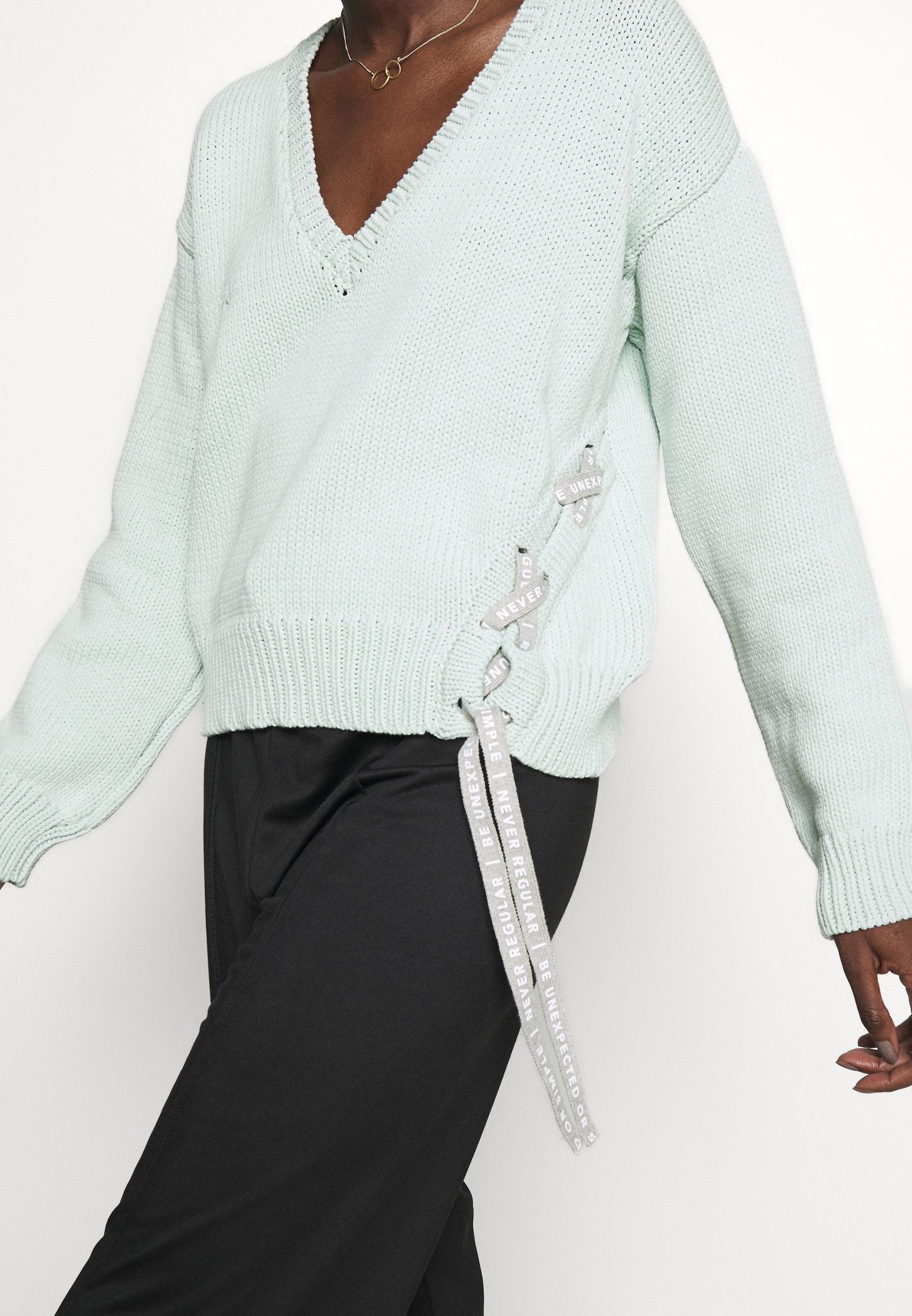 turquoise v neck sweater