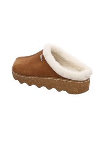 Zapatilla de ante marrón con forro de piel blanca, suela de corcho gruesa y borde en zigzag. Presenta una costura bordada y una pequeña etiqueta de marca.