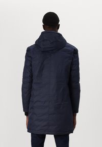 Navy puffer coat with a hood, long sleeves, and a straight cut. Smooth texture with minimal seams and a clean design.